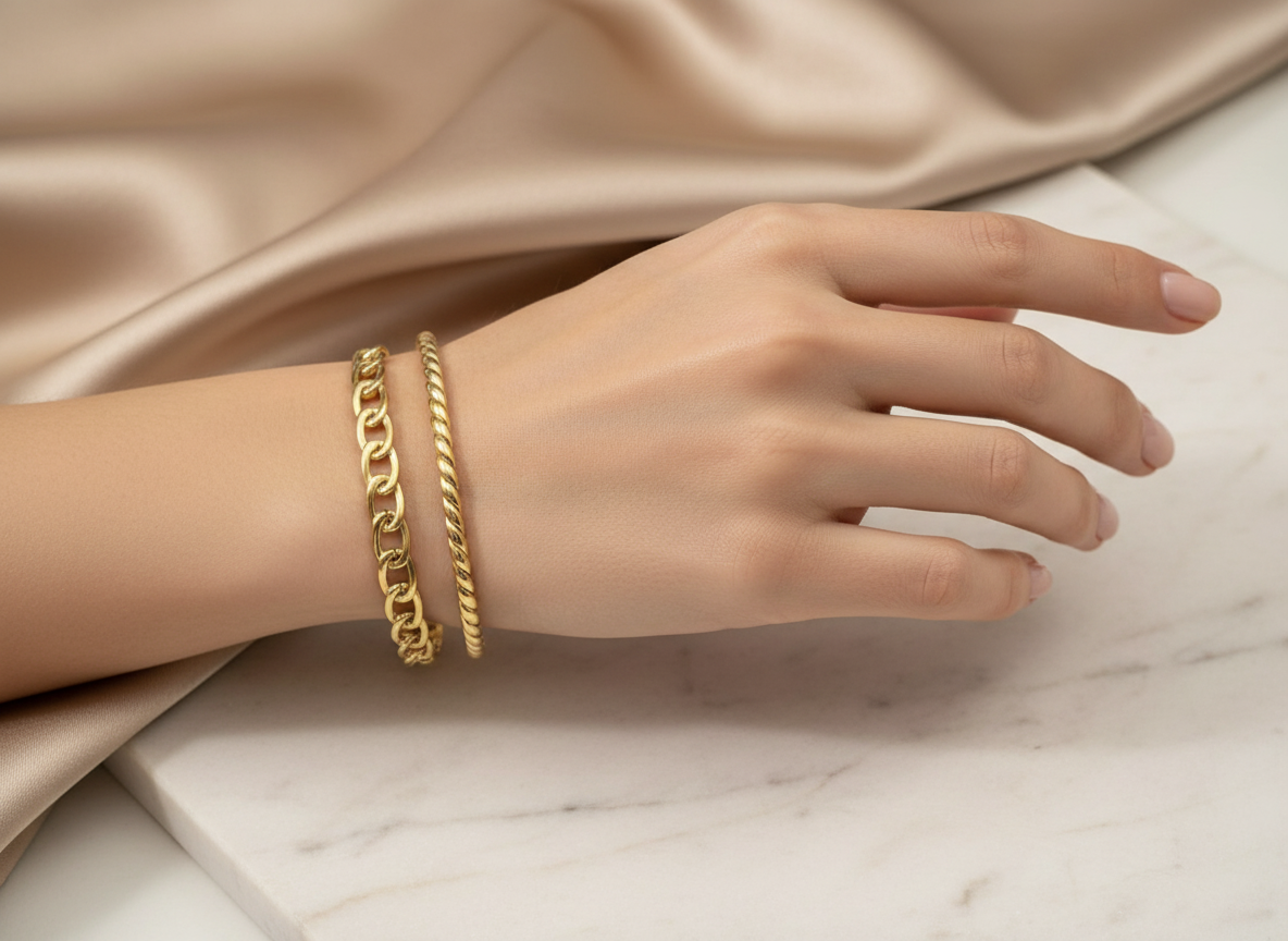 Gold-plated layered chain cuff bracelet on model's hand