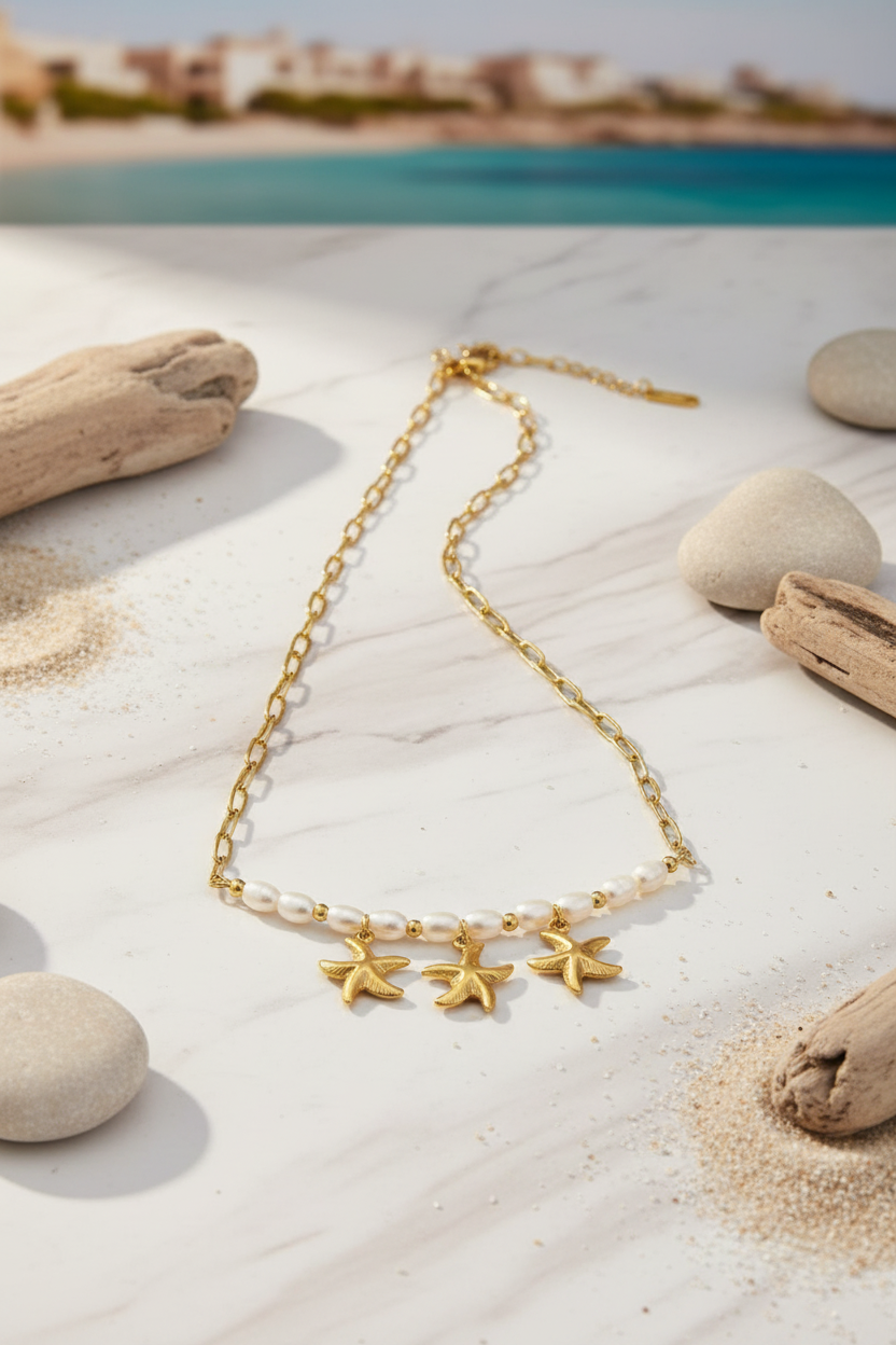 Gold-plated starfish and pearl necklace in coastal luxury setting